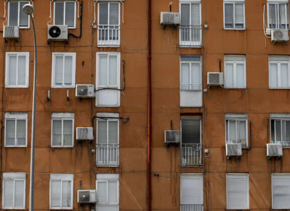 Air conditioning units are seen on the exterior of apartment buildings as temperatures continue to soar on July 14, 2022 in Madrid, Spain. Europe is currently experiencing the most sustained period of extreme hot weather in 50 years.